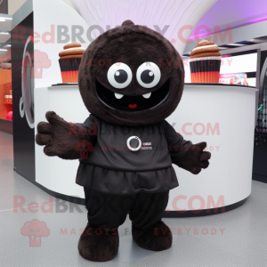 Black Cupcake mascot costume character dressed with a Hoodie and Clutch bags