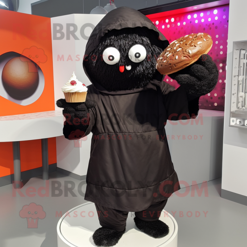 Black Cupcake mascot costume character dressed with a Hoodie and Clutch bags Black Cupcake mascot costume character dressed with a Hoodie and Clutch bags