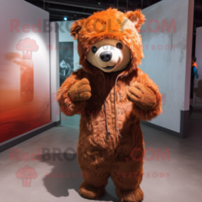 Rust Sloth Bear mascot costume character dressed with a Hoodie and Hairpins