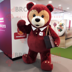 Maroon Bear mascot costume character dressed with a Blouse and Handbags
