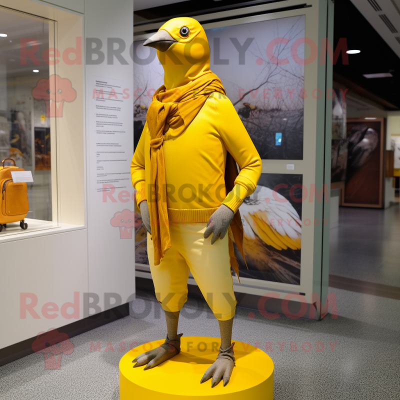 Yellow Passenger Pigeon mascot costume character dressed with a Joggers and Scarf clips