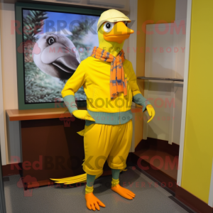 Yellow Passenger Pigeon mascot costume character dressed with a Joggers and Scarf clips