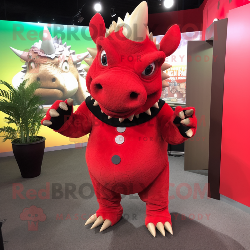 Red Triceratops mascot costume character dressed with a Jumpsuit and Tie pins