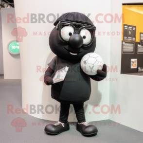 Black Handball Ball mascot costume character dressed with a Overalls and Reading glasses