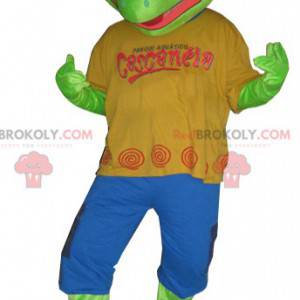 Green frog mascot dressed in a colorful outfit - Redbrokoly.com