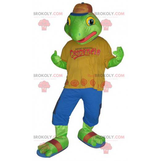 Green frog mascot dressed in a colorful outfit - Redbrokoly.com