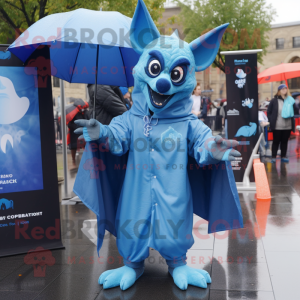 Blue Gargoyle mascot costume character dressed with a Raincoat and Wraps
