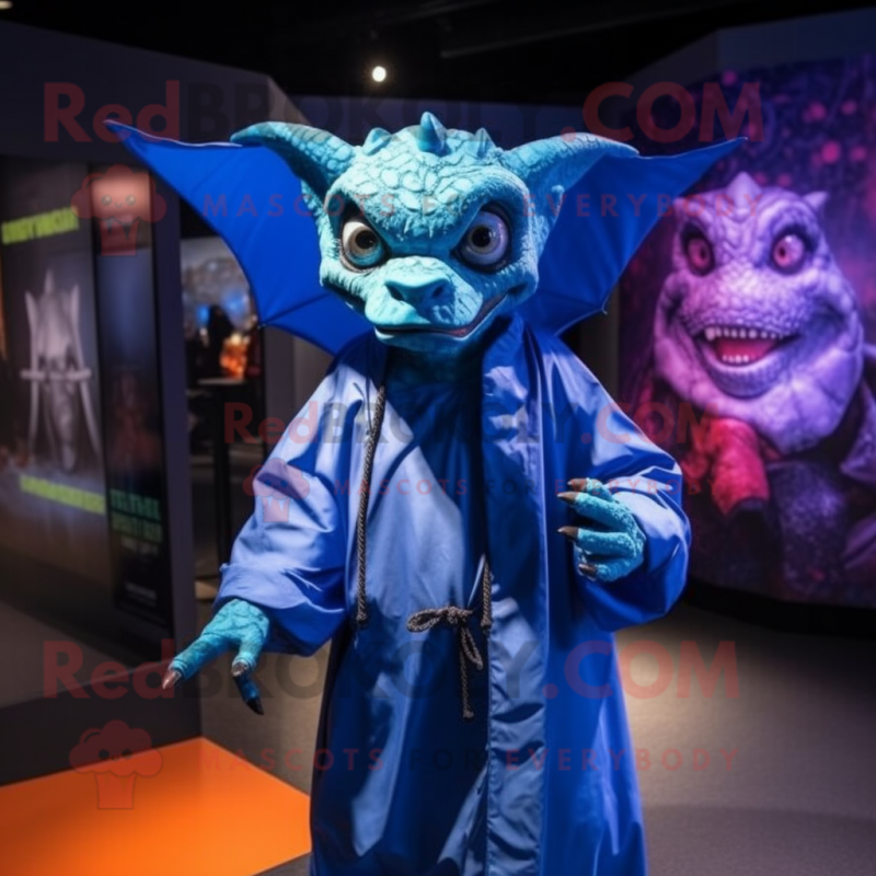 Blue Gargoyle mascot costume character dressed with a Raincoat and Wraps