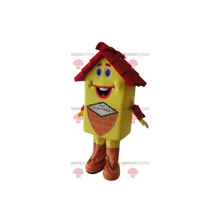 Mascote da casa amarela e vermelha muito sorridente -