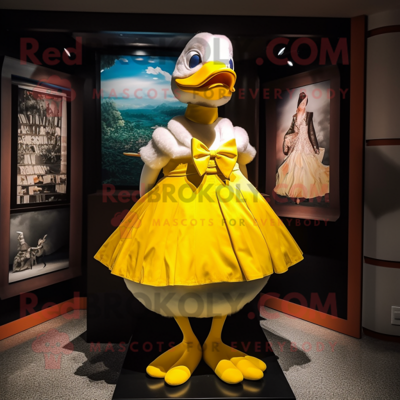 Yellow Geese mascot costume character dressed with a Dress and Bow ties Yellow Geese mascot costume character dressed with a Dress and Bow ties