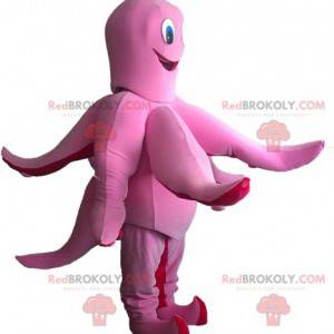 Mascotte de pieuvre rose et rouge amusante et souriante -