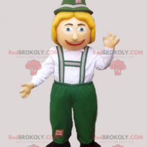 Tiroler mascotte in traditionele groene en witte kleding -