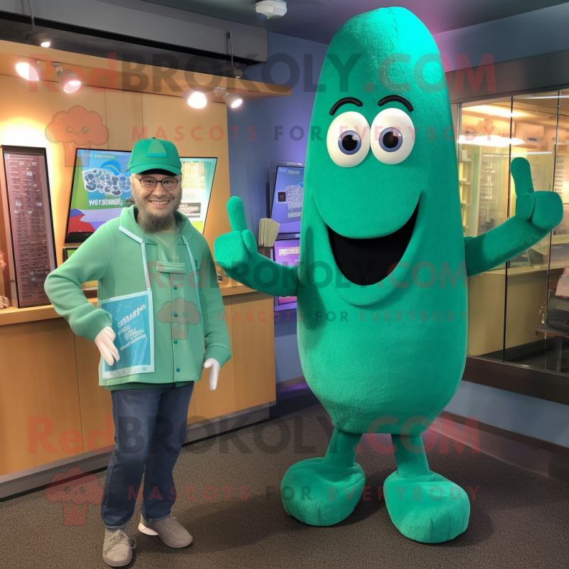 Teal Asparagus mascot costume character dressed with a Long Sleeve Tee and Watches Teal Asparagus mascot costume character dressed with a Long Sleeve Tee and Watches
