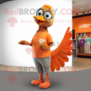 Orange Peacock mascot costume character dressed with a Henley Shirt and Bracelets