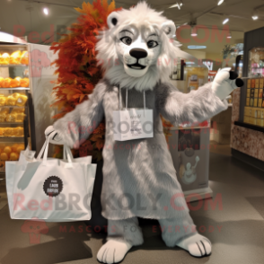 Silver Lion mascot costume character dressed with a Shift Dress and Tote bags