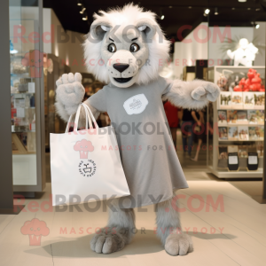 Silver Lion mascot costume character dressed with a Shift Dress and Tote bags