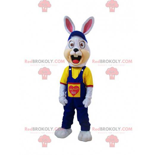 Angry white rabbit mascot dressed in blue overalls -