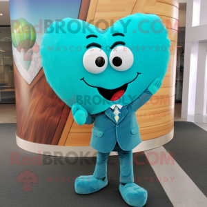 Turquoise Heart mascot costume character dressed with a Suit Pants and Tie pins