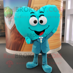 Turquoise Heart mascot costume character dressed with a Suit Pants and Tie pins