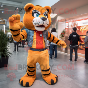Orange Saber-Toothed Tiger mascot costume character dressed with a Flare Jeans and Watches