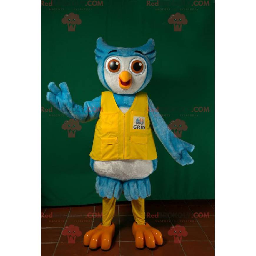 Blauwe en witte uil mascotte met een geel vest - Redbrokoly.com