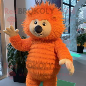 Orange Porcupine mascot costume character dressed with a Sweater and Mittens