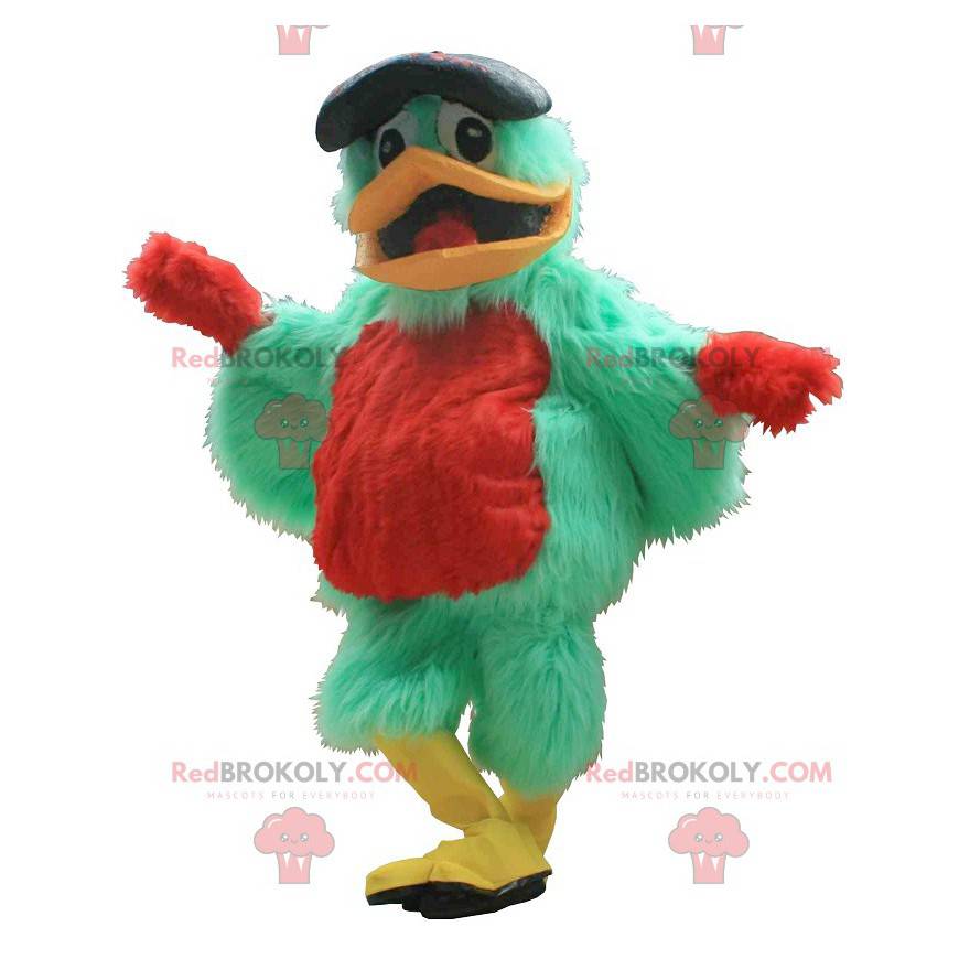 Grünes und rotes Vogelmaskottchen mit einer Baskenmütze -