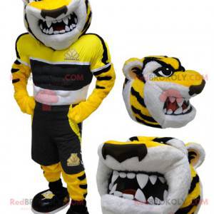 Mascota de tigre blanco y negro amarillo mirando feroz -