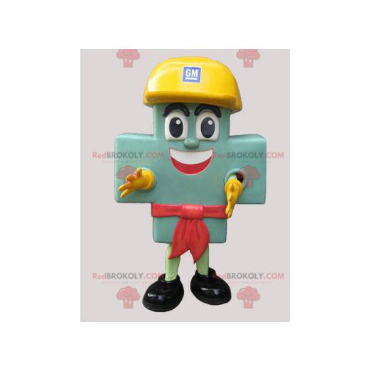 Gigante mascotte croce verde con un casco giallo -