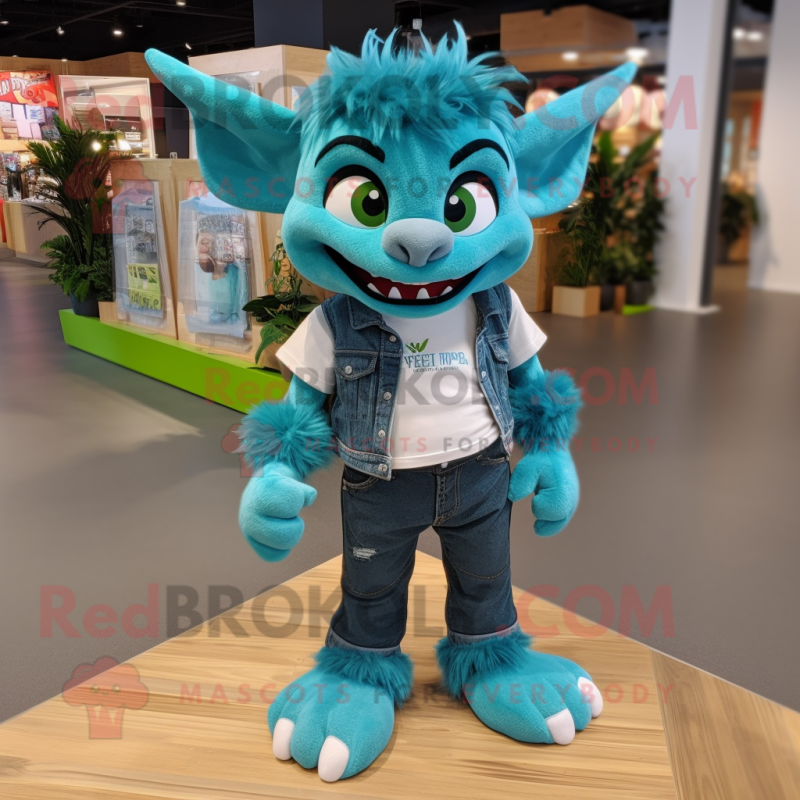 Teal Gargoyle mascot costume character dressed with a Boyfriend Jeans and Shoe laces