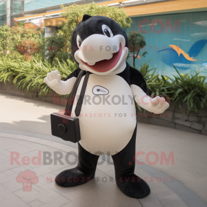 Cream Killer Whale mascot costume character dressed with a V-Neck Tee and Messenger bags