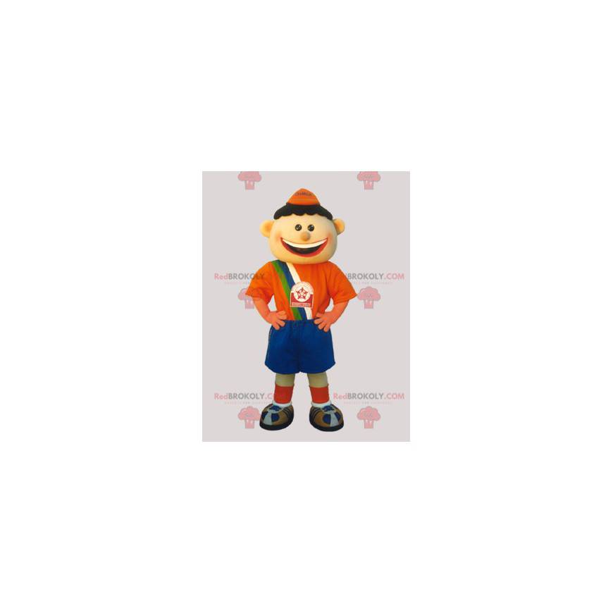 Mascotte de garçon de footballeur habillé en orange et bleu -
