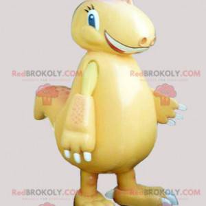 Mascotte de dinosaure jaune géant et souriant - Redbrokoly.com
