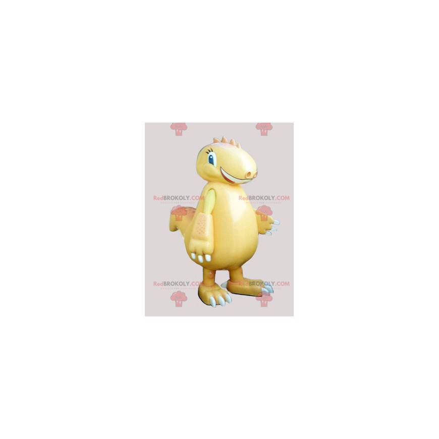 Mascota dinosaurio amarillo gigante y sonriente - Redbrokoly.com