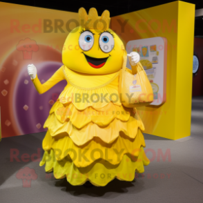 Yellow Candy Box mascot costume character dressed with a Ball Gown and Tote bags