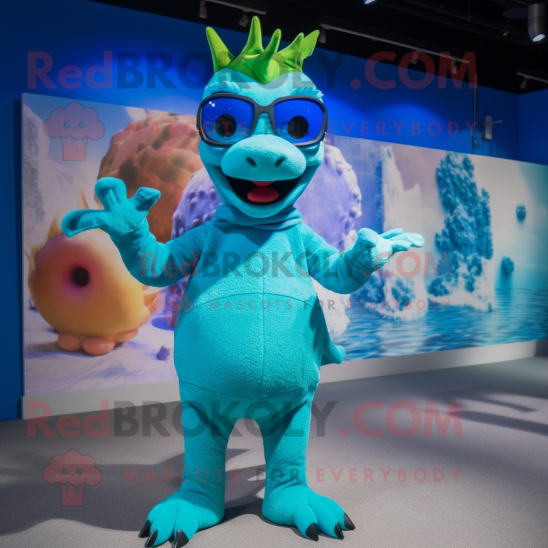 Cyan Dragon mascot costume character dressed with a Swimwear and Eyeglasses Cyan Dragon mascot costume character dressed with a Swimwear and Eyeglasses