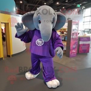 Purple Elephant mascot costume character dressed with a Long Sleeve Tee and Backpacks