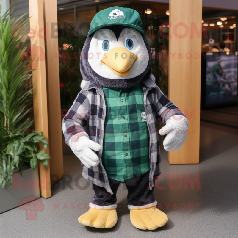 Forest Green Penguin mascot costume character dressed with a Flannel Shirt and Caps