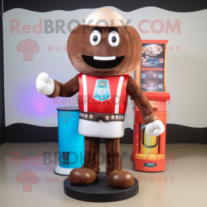Brown Gumball Machine mascot costume character dressed with a Rash Guard and Shoe clips