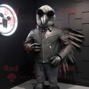Silver Blackbird mascot costume character dressed with a Biker Jacket and Digital watches