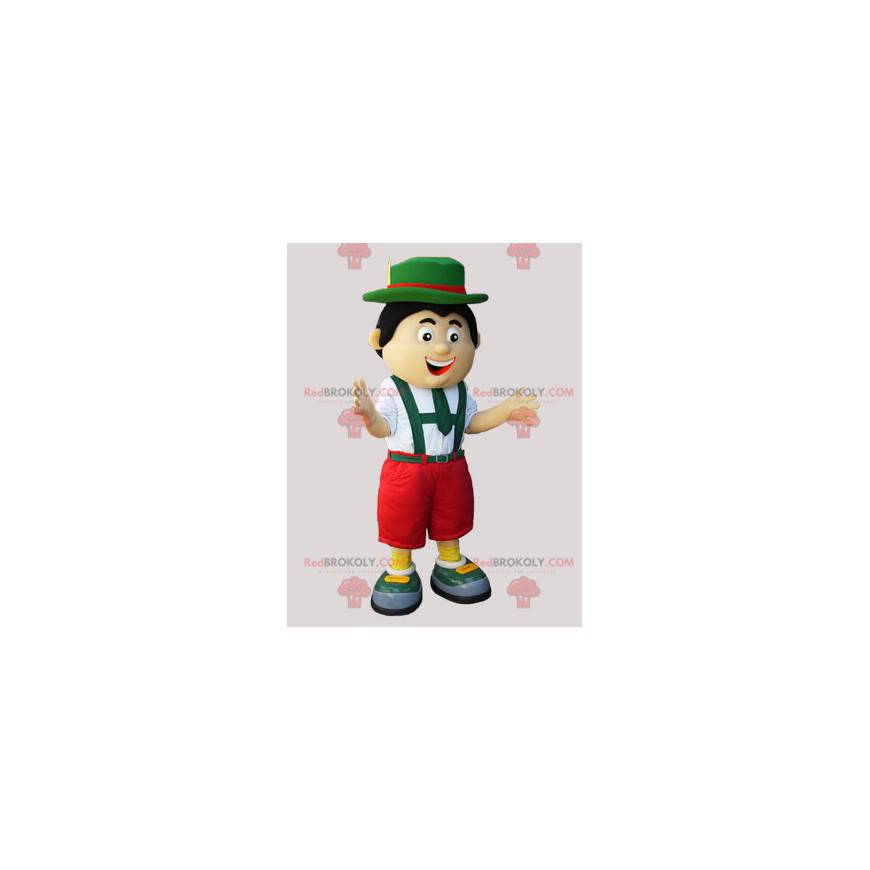 Tyrolský maskot v tradičních zeleno-červených a bílých šatech -