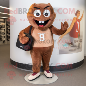 Brown Engagement Ring mascot costume character dressed with a Joggers and Clutch bags