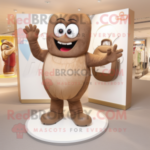 Brown Engagement Ring mascot costume character dressed with a Joggers and Clutch bags