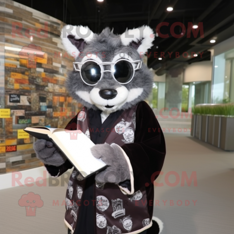 Black Civet mascot costume character dressed with a Cardigan and Reading glasses Black Civet mascot costume character dressed with a Cardigan and Reading glasses