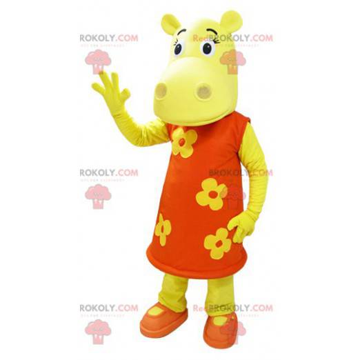 Yellow hippopotamus mascot dressed in an orange floral dress -