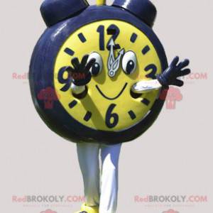 Mascota gigante de reloj despertador amarillo y negro. Mascota