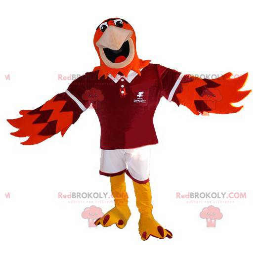 Mascote águia laranja e roxa em roupas esportivas -