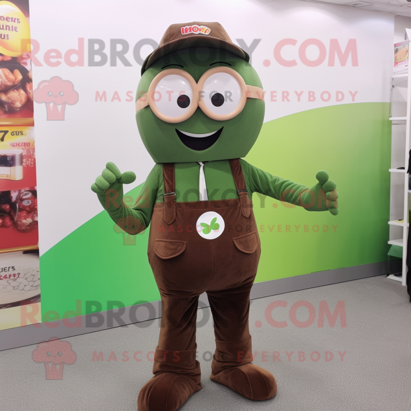 Olive Candy mascot costume character dressed with a Dungarees and Reading glasses Olive Candy mascot costume character dressed with a Dungarees and Reading glasses