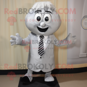 Silver But mascot costume character dressed with a Mini Dress and Tie pins