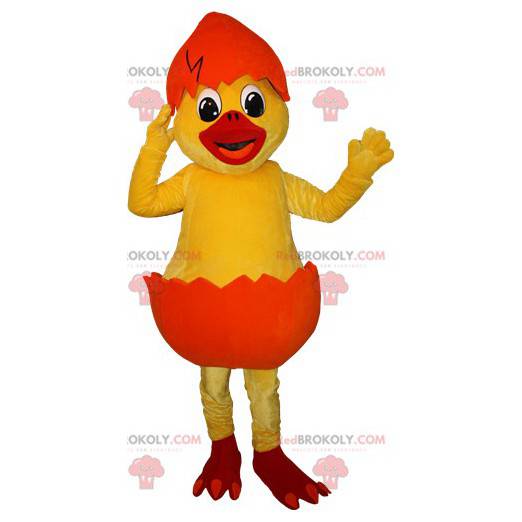 Mascotte de poussin jaune dans une coquille orange -